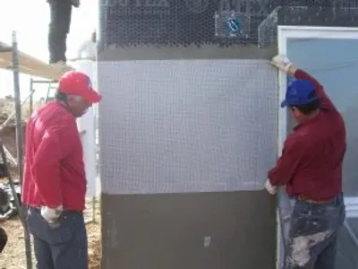 men reinforcing the structure of a home