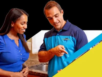 Z PLUMBERZ technician talking to a customer