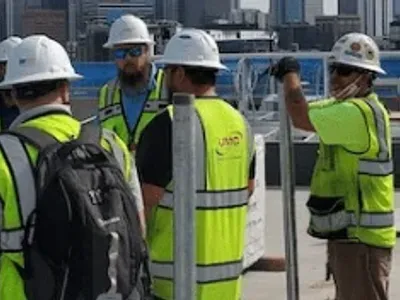 UMC HVAC and Plumbing employees outside
