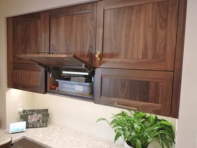 Dark wood kitchen cabinets with a white sink countertop