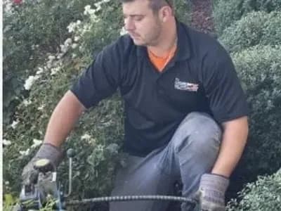 technician-cleaning-drain