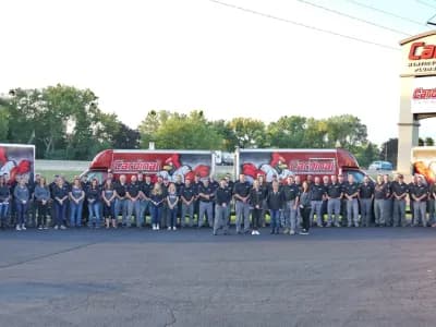 Cardinal Heating, Cooling, Plumbing & Electric employees and trucks