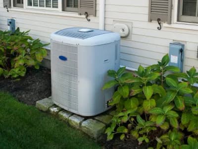 Heat pump installed outside Utah home — Utah heat pump rebates guide