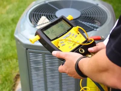 HVAC technician performing annual tune-up and maintenance