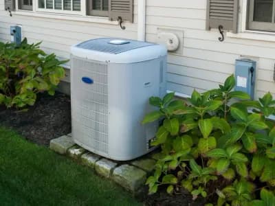 Modern heat pump installed outside a Utah home