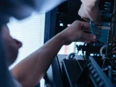 low voltage systems contractor working on a patch panel