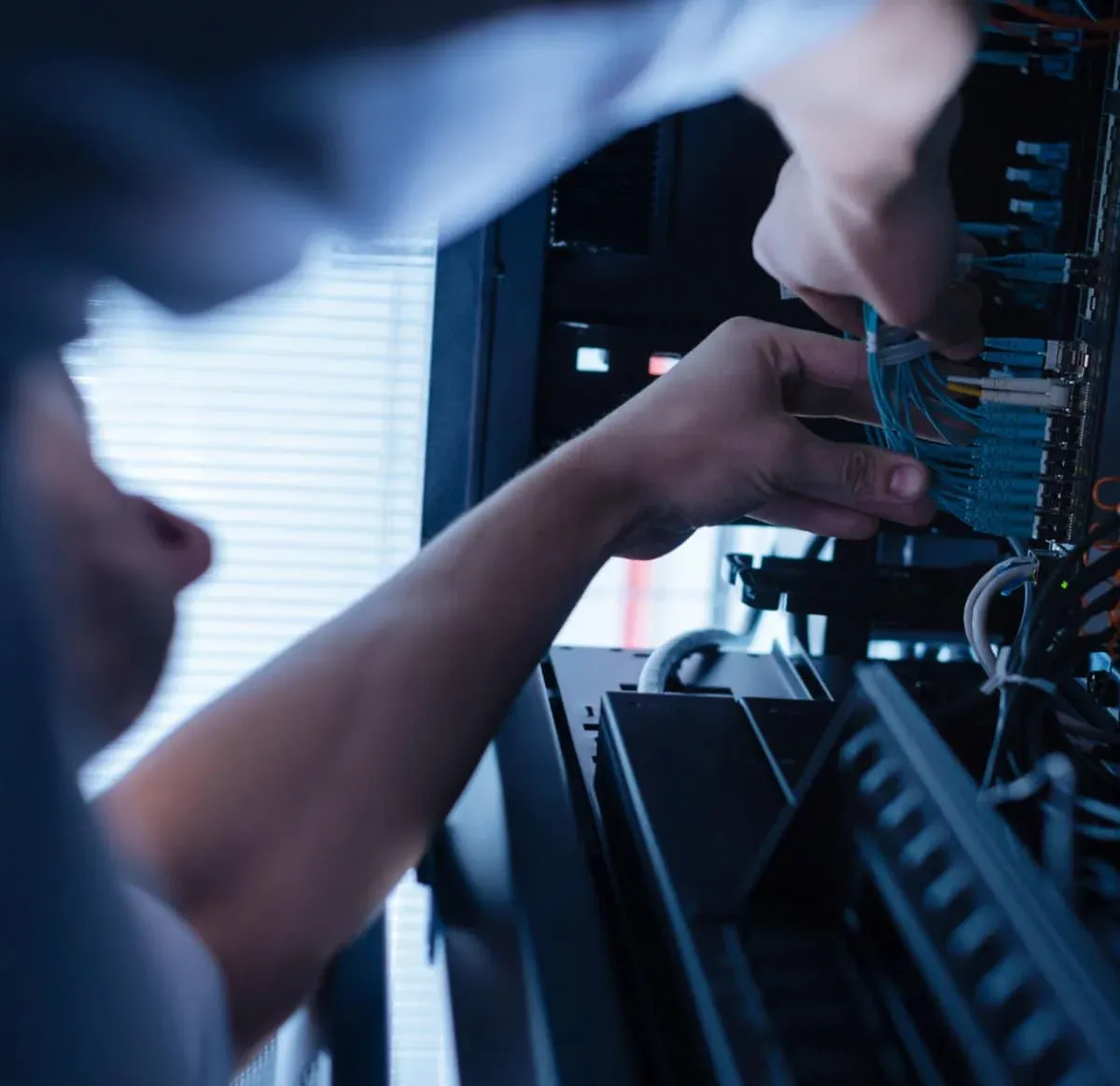 low voltage systems contractor working on a patch panel