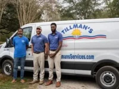Three Tillman's Services technicians standing in front of a branded service van, showcasing expertise and community commitment in HVAC solutions.