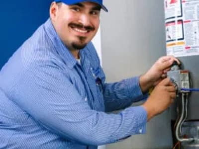 Al Coronado plumbing expert working on a water heater installation