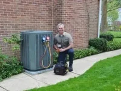 HARP technician inspecting a HVAC unit