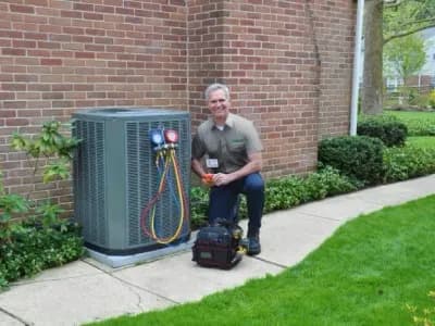 HARP technician inspecting a HVAC unit