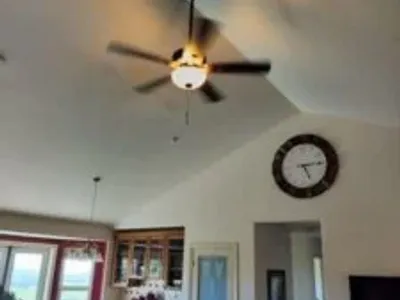 Ceiling fan on tall ceiling.