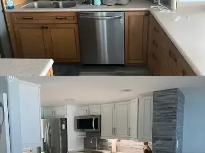 Stainless appliances blend seamlessly with white cabinets in a kitchen enhanced by Paint‑Pro’s.