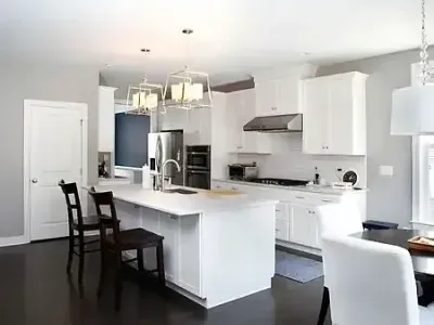 An open kitchen and dining area flow together beautifully with Paint‑Pro’s interior painting services.
