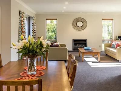 Sliding glass doors bring light into a dining room painted by Paint‑Pro’s.