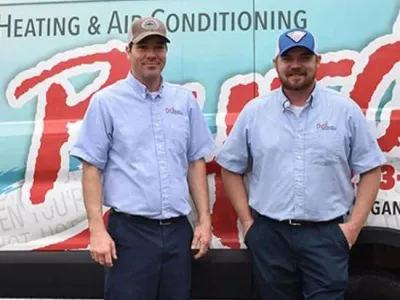 Byrd Heating And Airconditioning Team Tech In Front Of Van