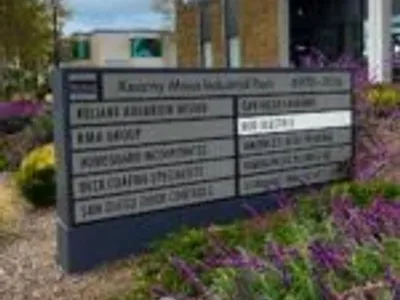 Kearny Mesa Industrial Park sign with Eco Electric San Diego highlighted