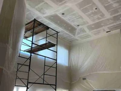 A room with a metal frame and white walls.