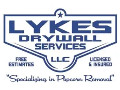 A blue and white logo for lykes drywall services.