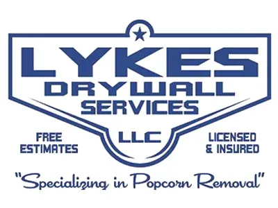 A blue and white logo for lykes drywall services.