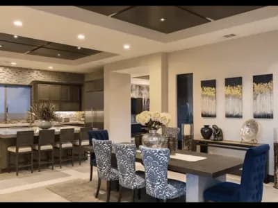 A dining room with blue chairs and a table