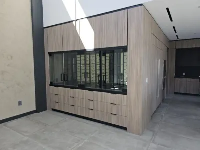 A room with many cabinets and windows in it