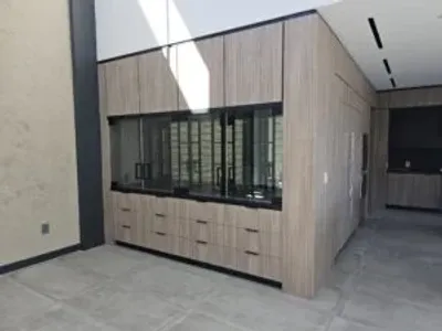 A room with many cabinets and windows in it