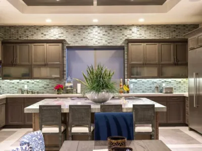 A kitchen with a table and chairs in it
