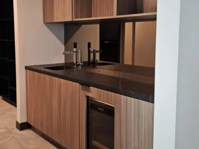 A kitchen with wooden cabinets and a sink.