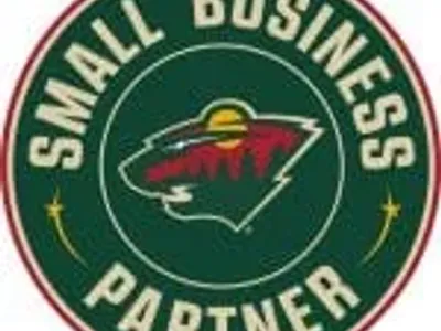 Minnesota Wild Small Business Partner logo with bear and trees.