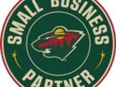 Minnesota Wild Small Business Partner logo with bear and trees.