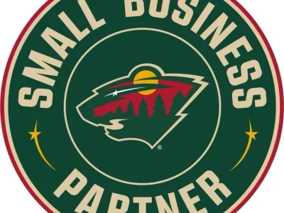 Minnesota Wild Small Business Partner logo with bear and trees.