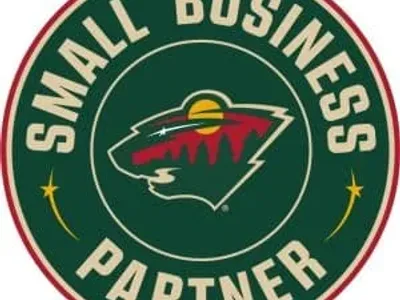 Minnesota Wild Small Business Partner logo with bear and trees.