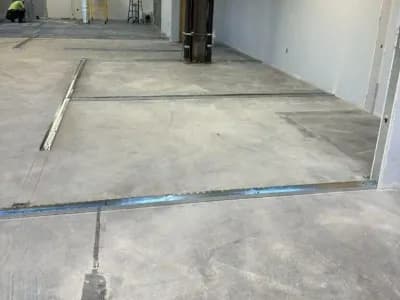 An empty workspace prepared for metal stud framing.