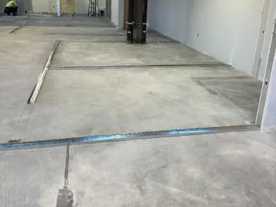 An empty workspace prepared for metal stud framing.