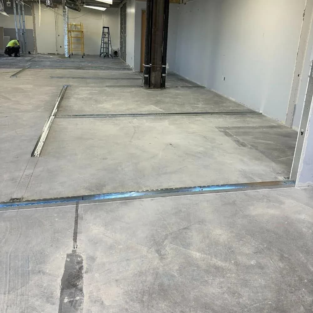 An empty workspace prepared for metal stud framing.