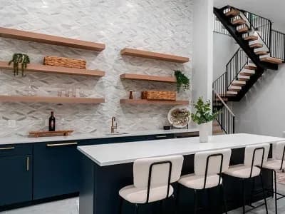 Modern Basement Bar with island and floating shelves