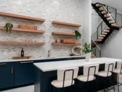 Modern Basement Bar with island and floating shelves