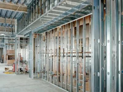 Steel studs with electrical conduit, used to frame in a large commercial building.