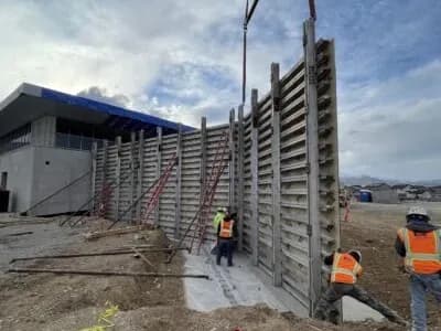 20' CIP concrete walls; 1,250 LF architectural walls
