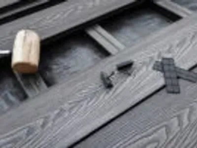 Installation services showing tools and composite decking materials in progress