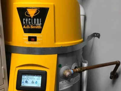 Hot water heater by A.O. Smith, featuring a yellow exterior and digital display, representing Nespolo Mechanical's hot water heater replacement services in Bernalillo, NM.