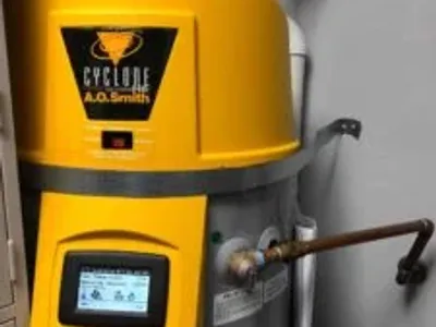 Hot water heater by A.O. Smith, featuring a yellow exterior and digital display, representing Nespolo Mechanical's hot water heater replacement services in Bernalillo, NM.